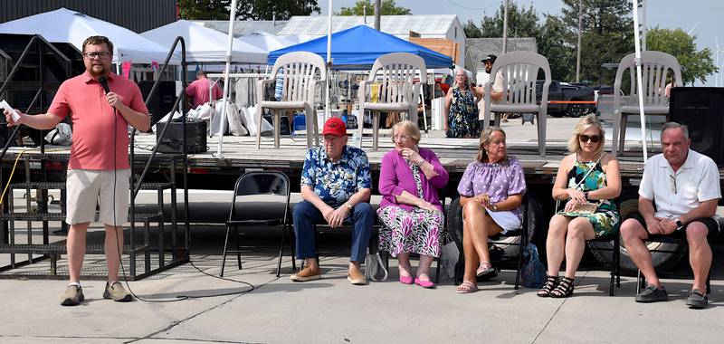 Orient Area Betterment President Ryan Frederick, far left, introduces Don and Charlene Lamberti, Kim, Linda and Jeff Saturday announcing a $1 million contribution to be used toward improvements for the town.