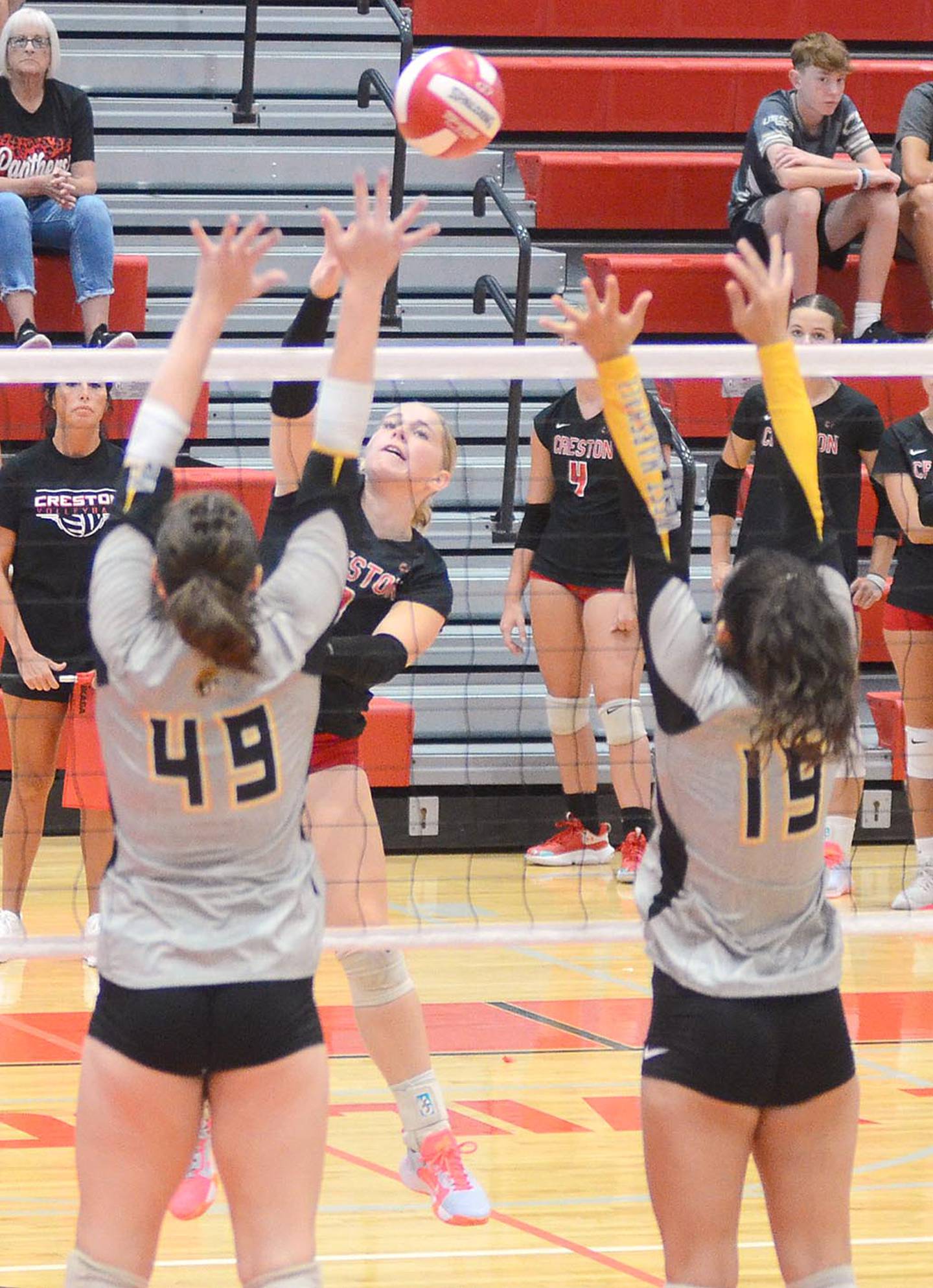 Jaycee Hanson of Creston sends an attack into the West Marshall court during the Panthers 21-13, 21-17 victory over the Trojans. Hanson had five kills in the two sets.