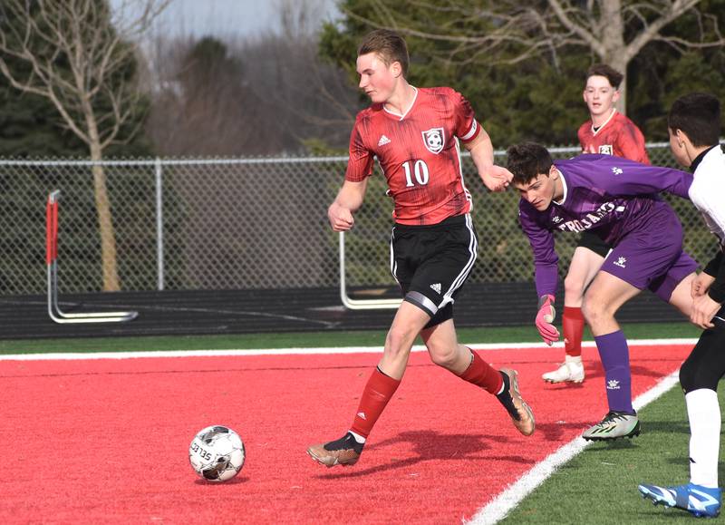 Creston senior Dillon Starlin launches a ball into the goal in the first half. He scored three on the night.