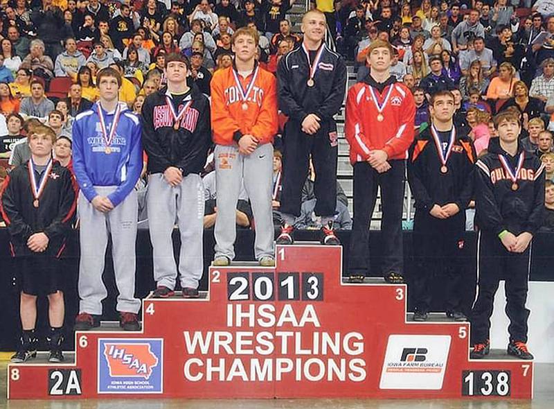 Jake Marlin of Creston was presented his fourth gold medal at the 2013 Iowa State Wrestling Tournament. He was southwest Iowa's first four-time champion.