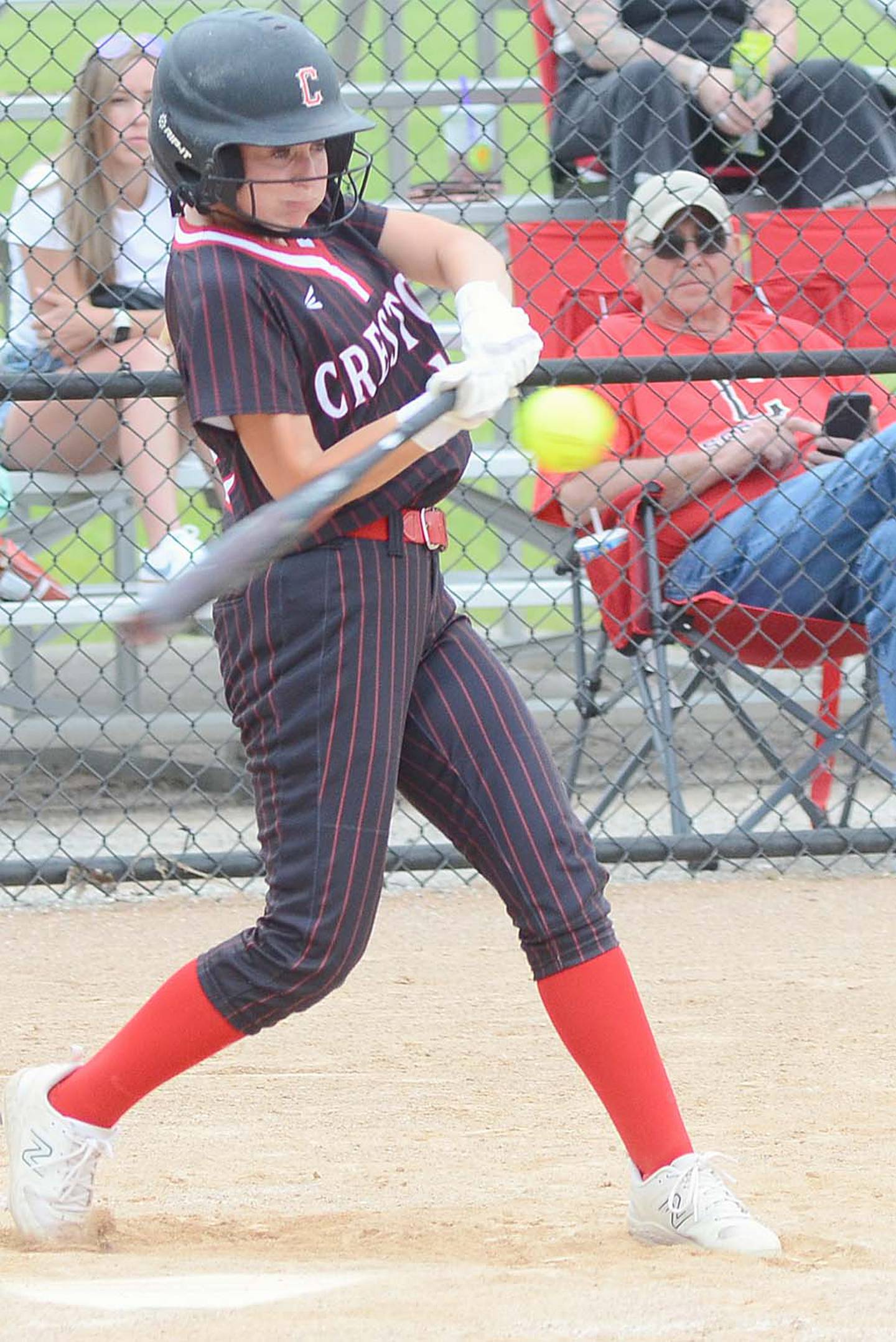 Creston right fielder Sasha Wurster connects with a pitch during Thursday's game against Glenwood. Wurster hit a two-run single and had two long flyouts to the warning track in the 11-1 victory.