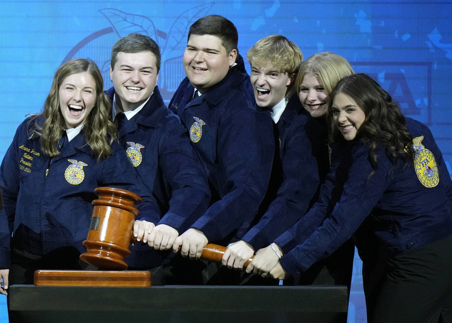 The National FFA officer team for 2023-24 bangs the gavel at the National Convention in Indianapolis earlier this month. From left, President Amara Jackson, Secretary Grant Norfleet, Vice President (Southern Region) Carter Howell, Vice President (Central Region) Kanyon Huntington of Afton, Vice President (Eastern Region) Morgan Anderson and Vice President (Western Region) Emily Gossett.