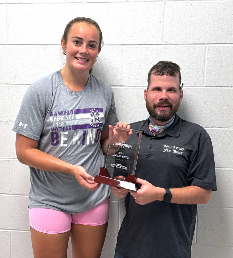 Lindsey Davis, an Upper Iowa womens basketball signee and a 2024 graduate of Nodaway Valley, receives the Female Athlete of the Year Award for south central Iowa from Adair County Free Press editor Caleb Nelson.