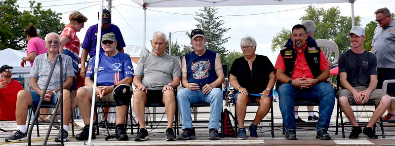 Veterans honored Saturday at Orient's Pumpkin Days with a quilt of valor are, from left, Gary Ferber, David Homan, Duane Osmun, Bill Martin, Nancy Ferber, Mike Metzger and Adam Leith.