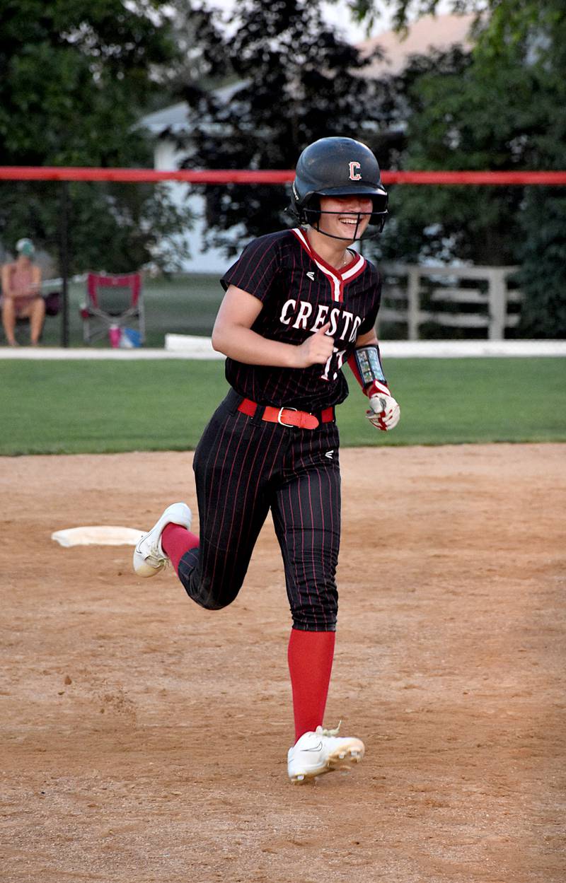 Creston's Taryn Fredrickson rounds second Tuesday with a smile after her two run home run in the sixth gave Creston a 4-2 lead. Creston defeated Clarke 4-3 to end the regular season.