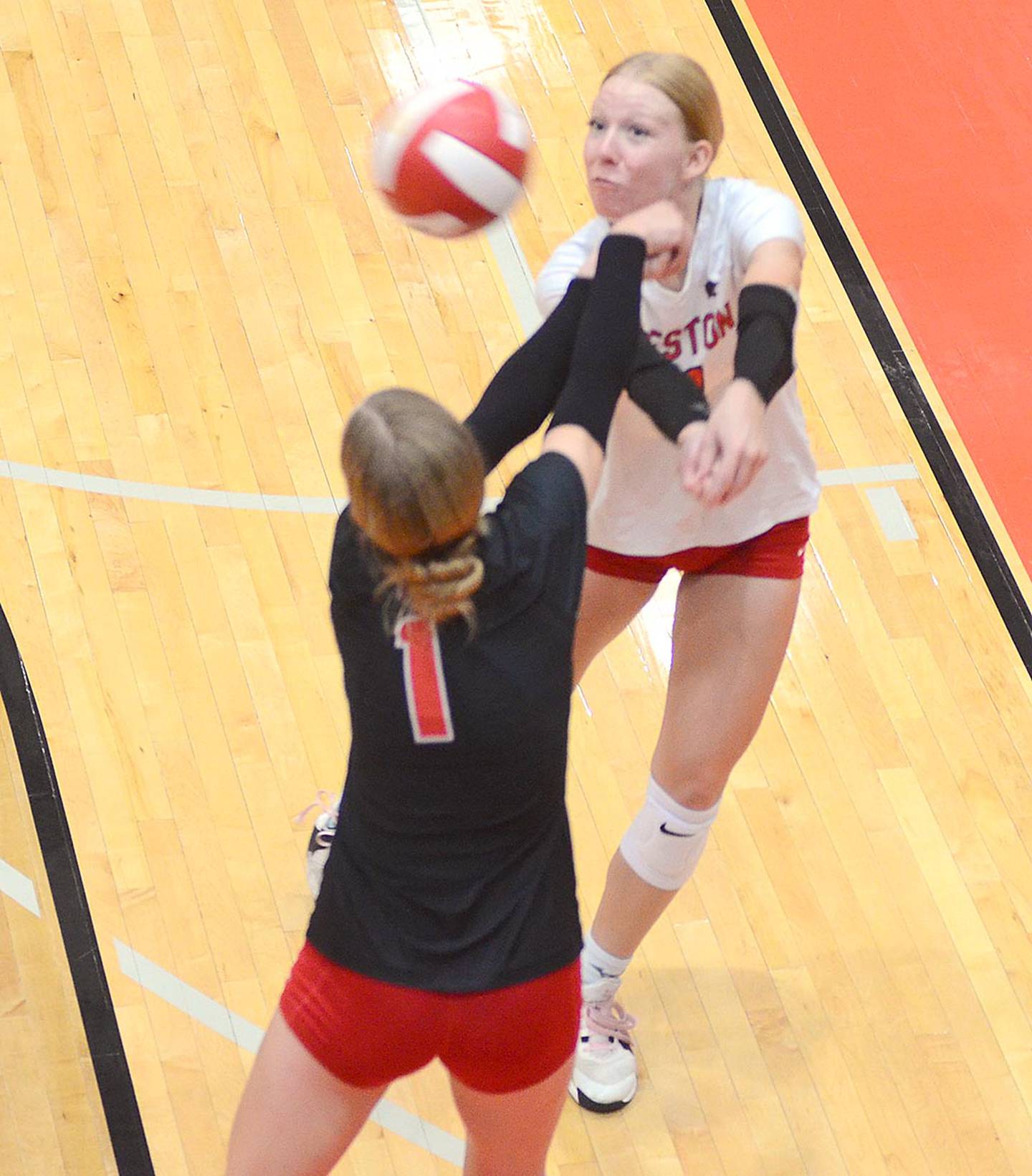 Creston libero Avery Staver and Kadley Bailey converge to receive a deep serve against Carlisle Thursday. Staver had a team-high seven digs in the match.