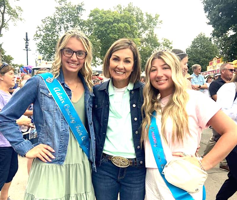 Adair County Fair Queen Bailey Carstens (left) with Governor Kim Reynolds and Adams County Fair Queen Tegan Hoyt.