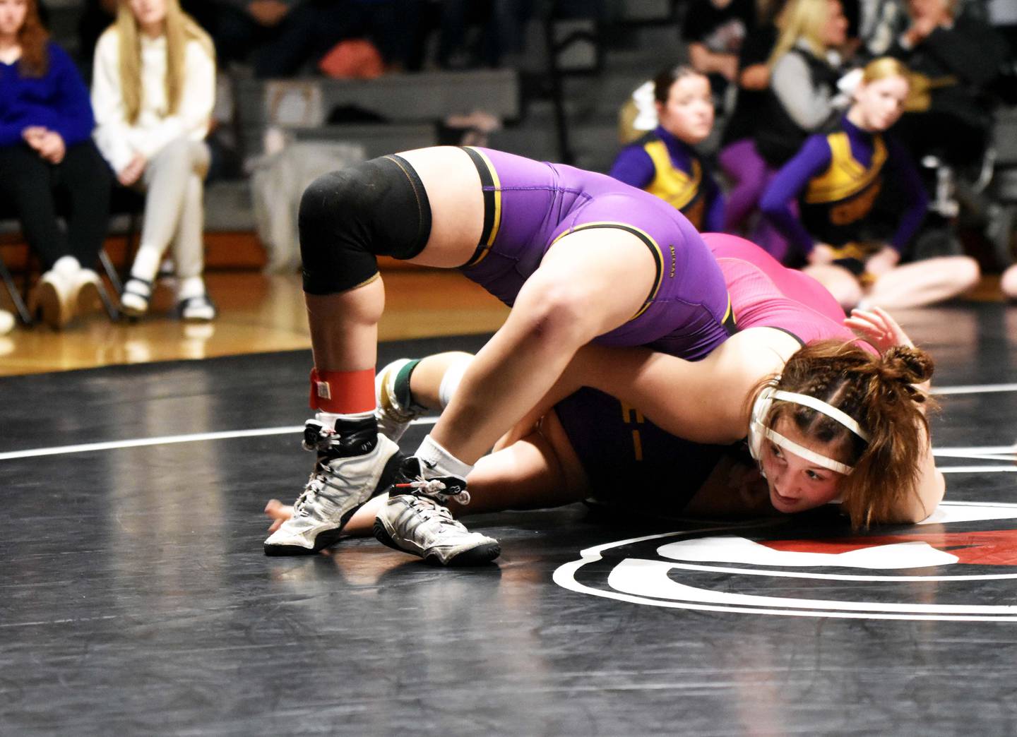 Grace Keeler (125) gets a second-period pin on Callie Chapman of Indianola.