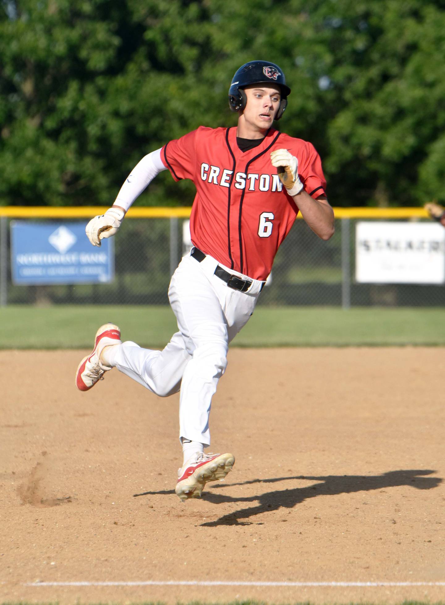 Senior Dylan Hoepker races home on a double by freshman Tom Mikkelsen in game one. He scored a run in both games.
