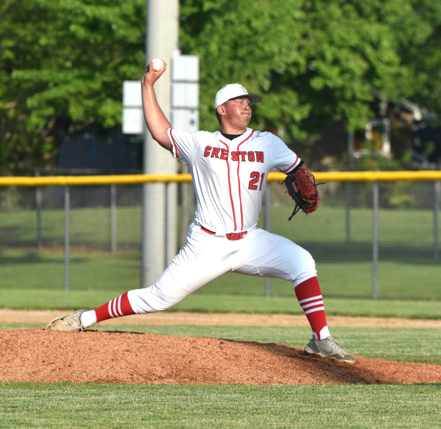 Quinten Fuller throws a pitch Monday at home against Indianola. Fuller pitched three innings, striking out one batter and allowing no runs in the 7-1 loss, their first of the season.
